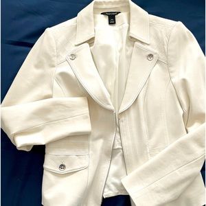 Two piece cream suit.